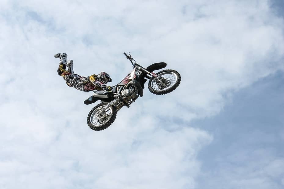 motorcycle rider doing stunts in midair