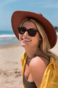 Woman wearing sunglasses on the beach